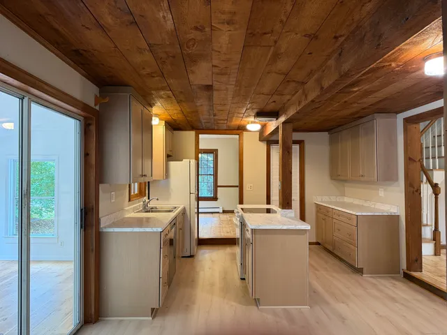 a view of a kitchen with furniture and large window