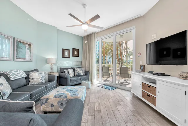 a living room with furniture and a flat screen tv