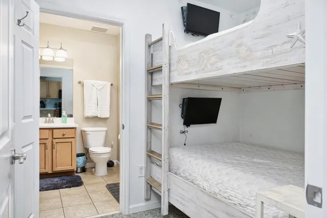 a bathroom with a toilet sink and shower