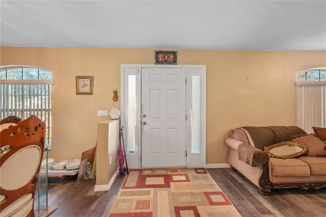 a living room with furniture and a rug