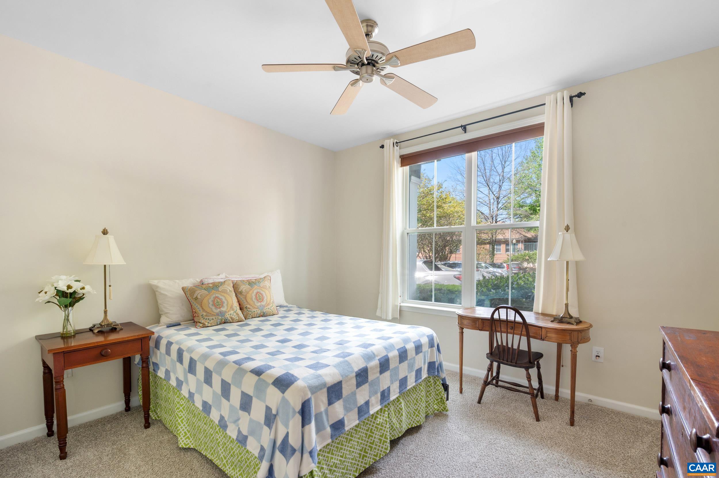 765 Walker Square, Unit 2D Charlottesville, VA 22903 - Photo 18 of 33 a bedroom with a bed and a table
