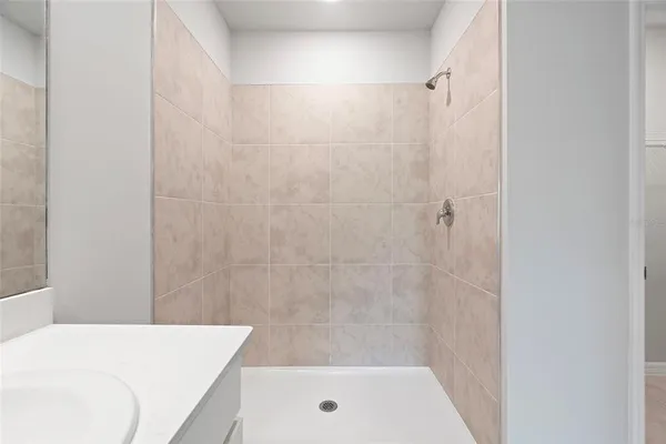 a bathroom with a sink a mirror and a bathtub