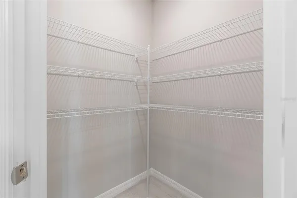 an empty room with a empty space and windows