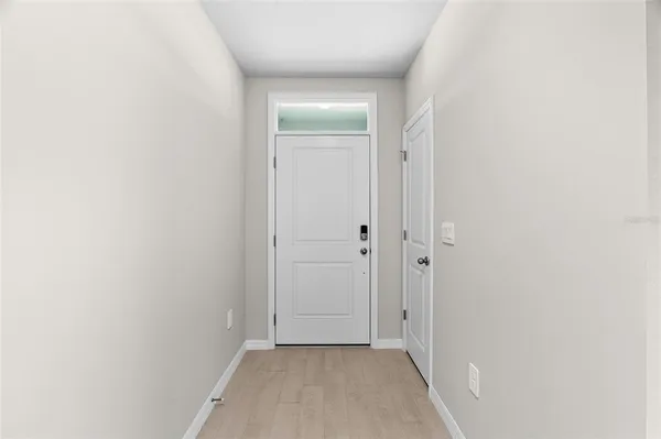 a view of hallway with closet