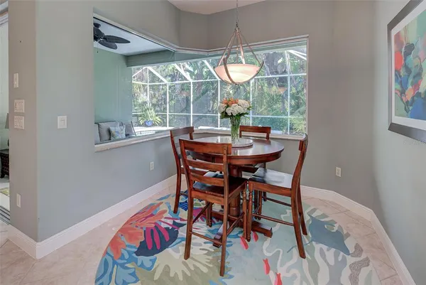 a view of a dining room with furniture wooden floor and chandelier