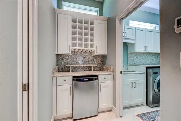 a kitchen with stainless steel appliances granite countertop a stove and a refrigerator