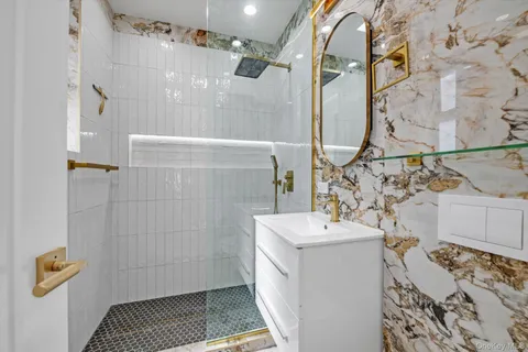 a bathroom with a sink toilet and shower