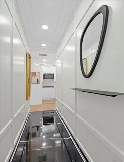 a view of a hallway with washer and dryer