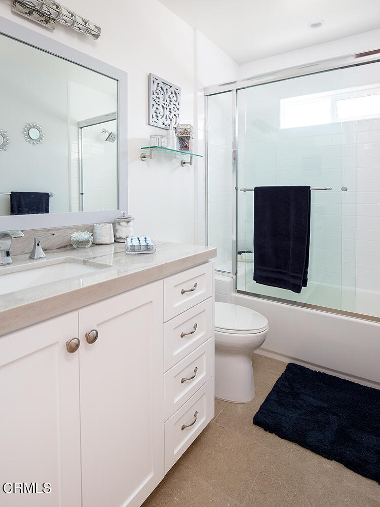 706 Tufts Avenue Burbank, CA 91504 - Photo 23 of 30 a spacious bathroom with a shower a sink and a mirror