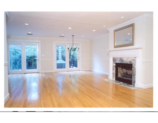 a view of an empty room and a fireplace