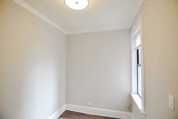 a view of small space with wooden floor