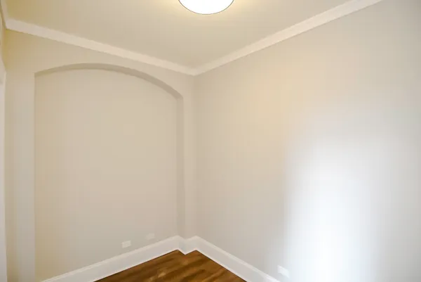 a view of a small space with wooden floor