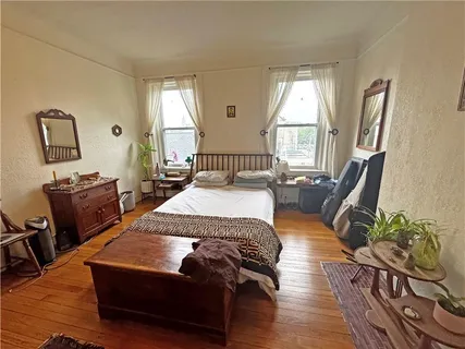 a living room with furniture rug and window