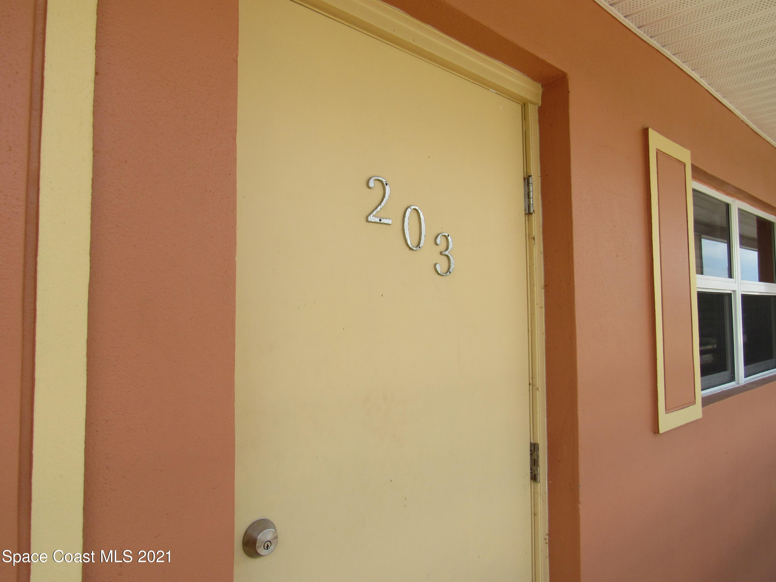 400 Catalina Road, Unit 203 Cocoa Beach, FL 32931 - Photo 2 of 10 a bathroom with a shower
