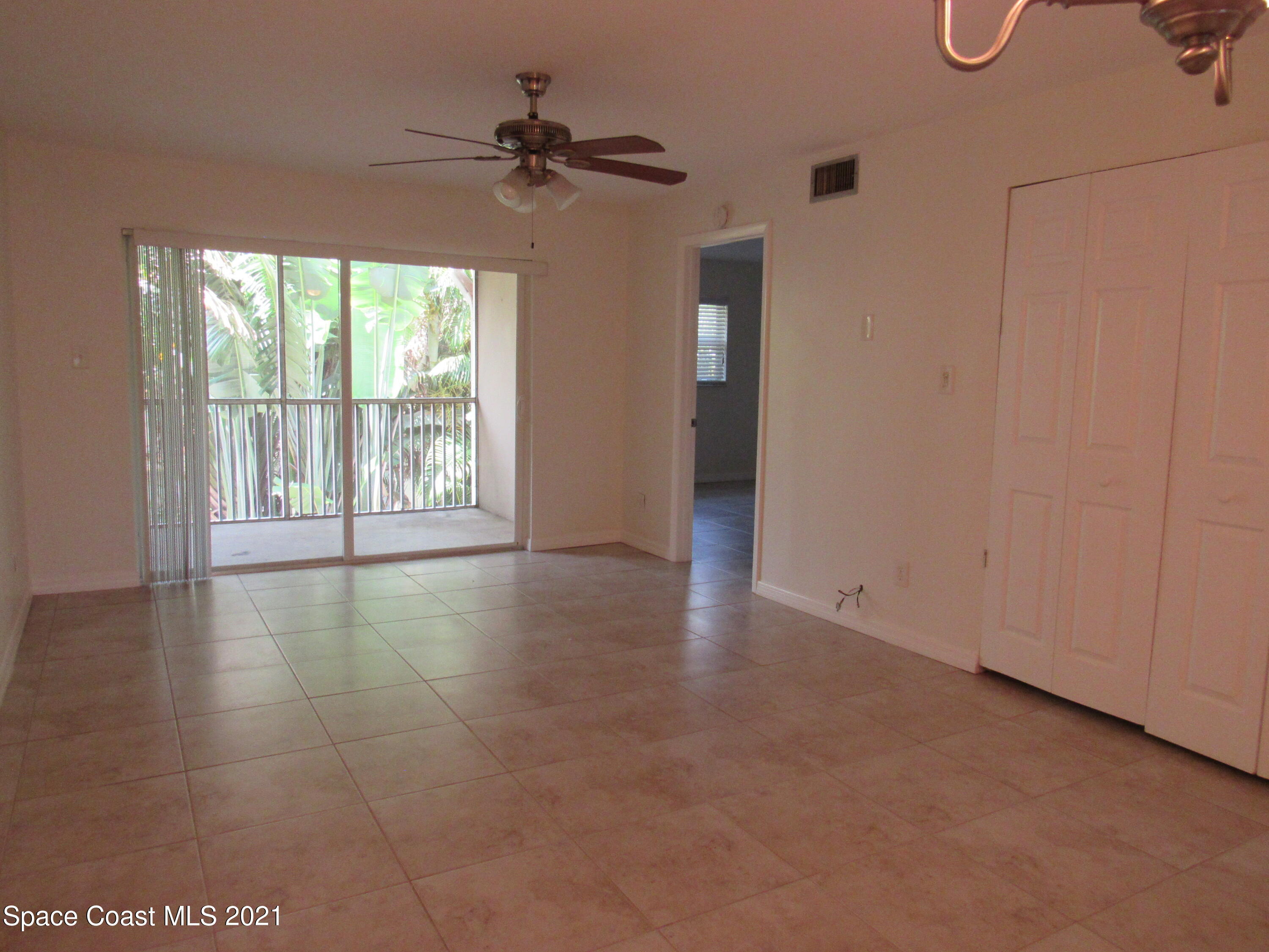 400 Catalina Road, Unit 203 Cocoa Beach, FL 32931 - Photo 10 of 10 a view of an empty room with a window