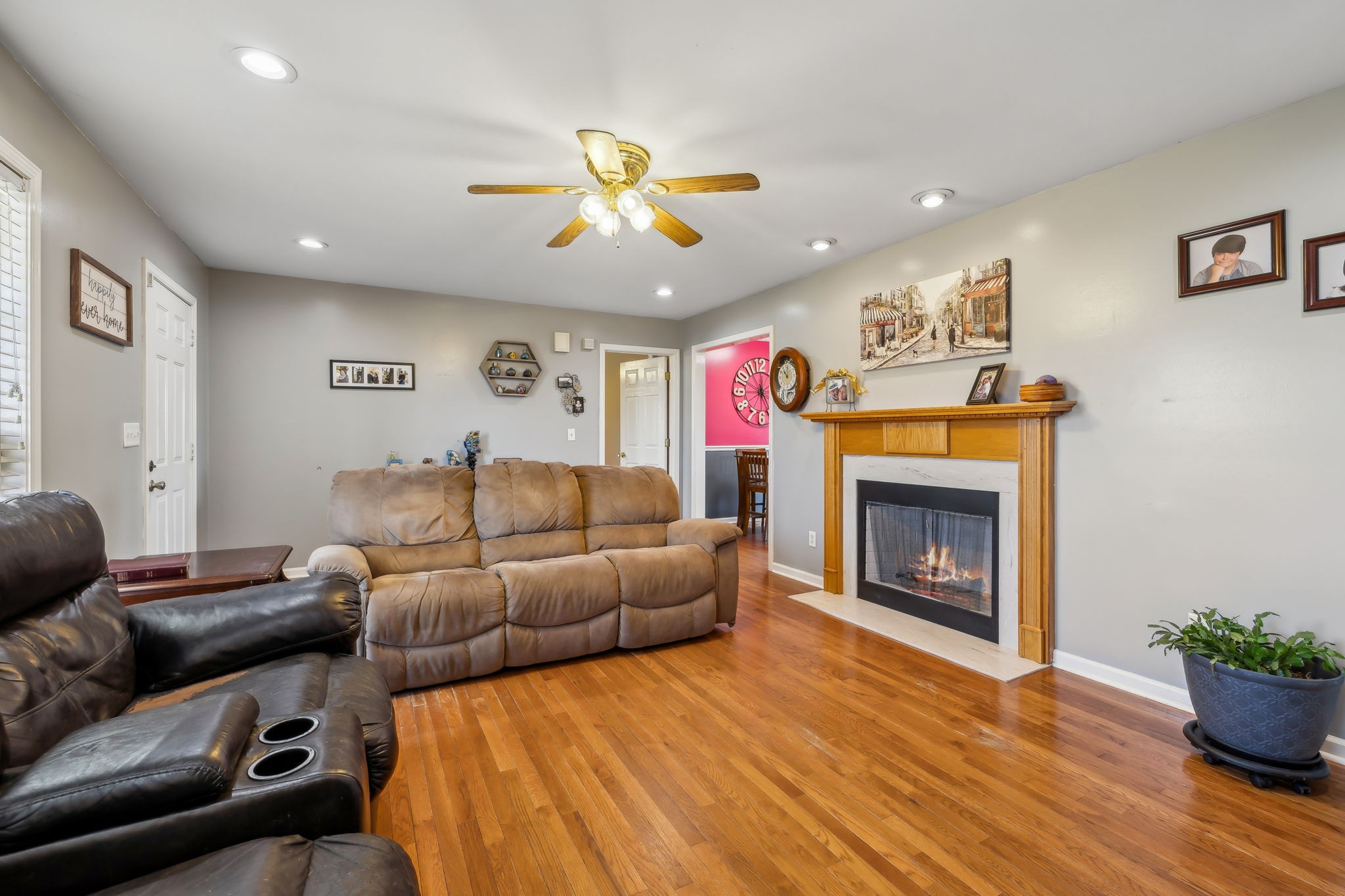 819 Blakemore Road Dickson, TN 37055 - Photo 11 of 54 a living room with furniture a fireplace and a potted plant