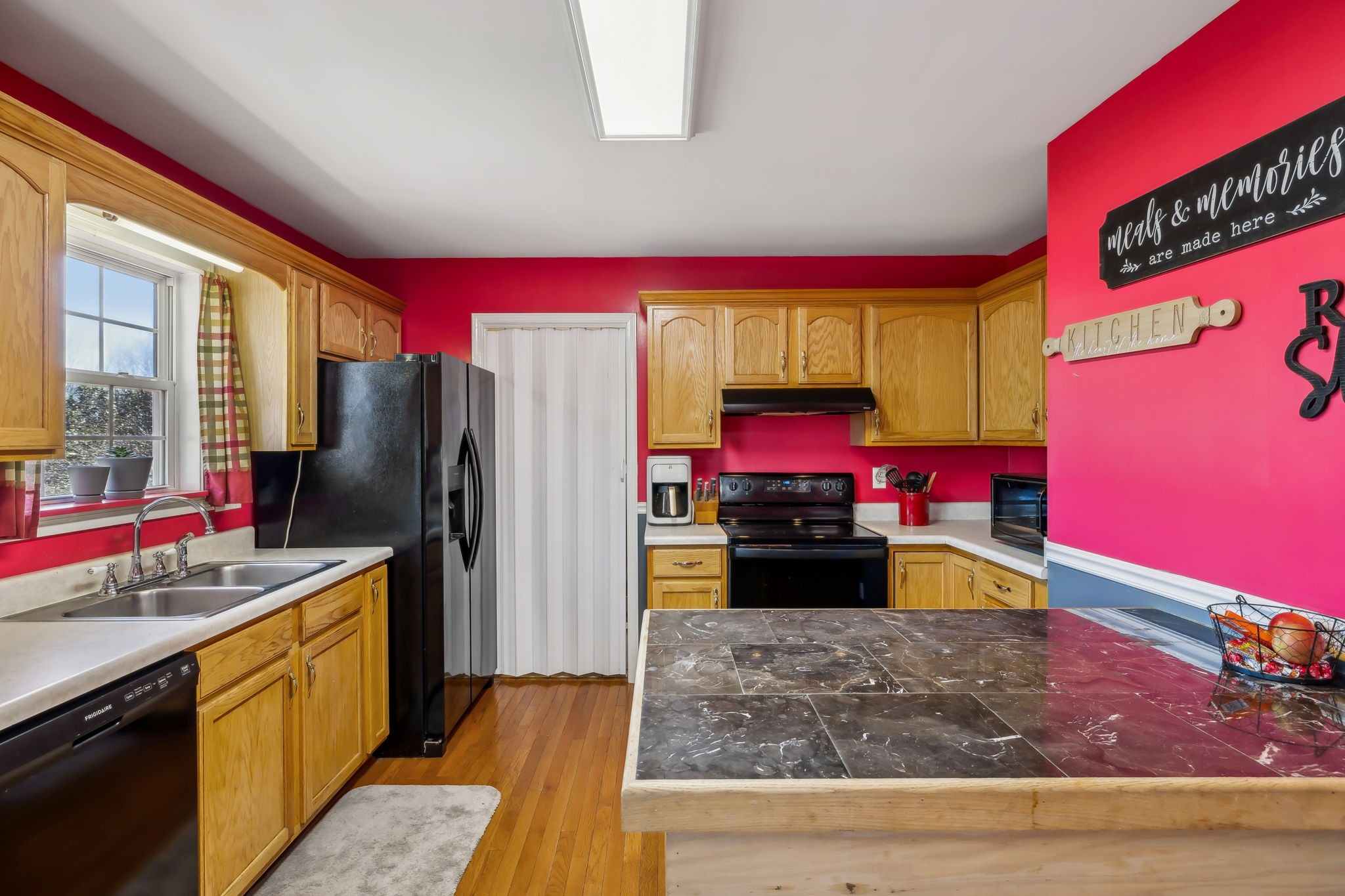 819 Blakemore Road Dickson, TN 37055 - Photo 17 of 54 a kitchen with kitchen island granite countertop a refrigerator stove top oven and sink