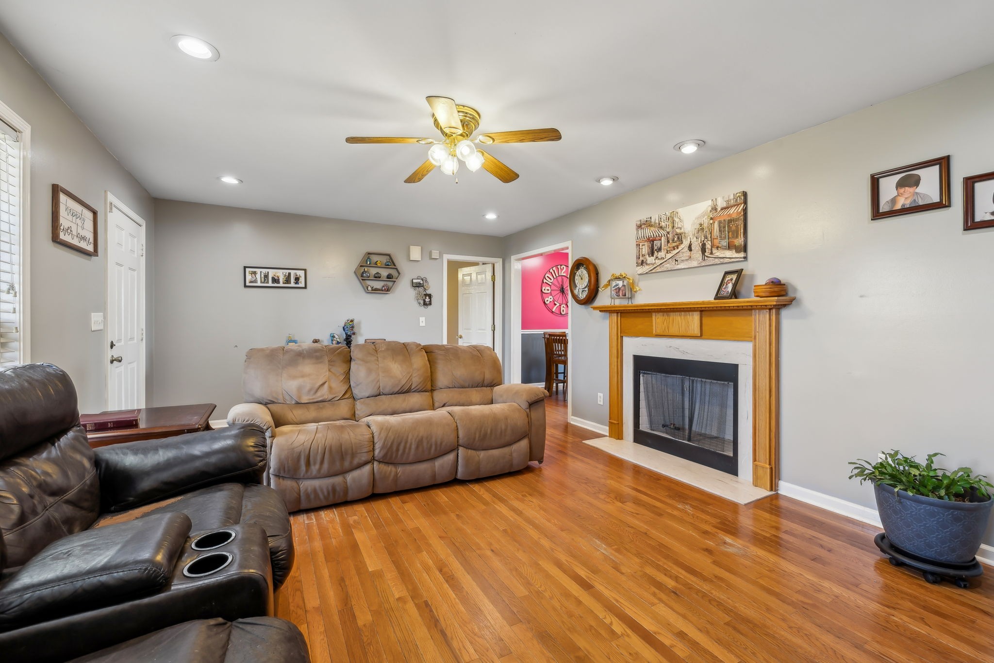 819 Blakemore Road Dickson, TN 37055 - Photo 18 of 54 a living room with furniture a fireplace and a potted plant