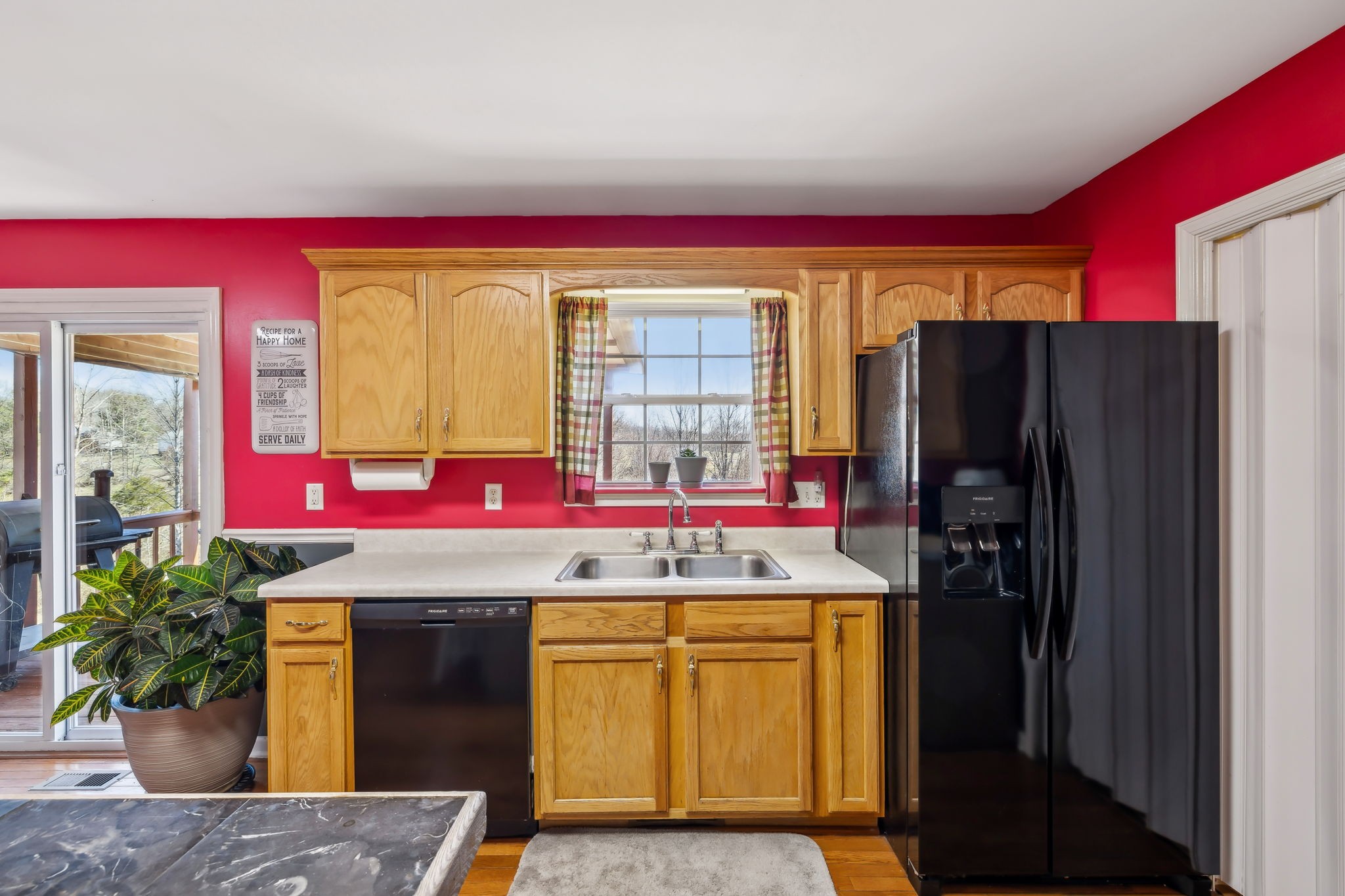 819 Blakemore Road Dickson, TN 37055 - Photo 19 of 54 a kitchen with stainless steel appliances granite countertop a refrigerator and a sink