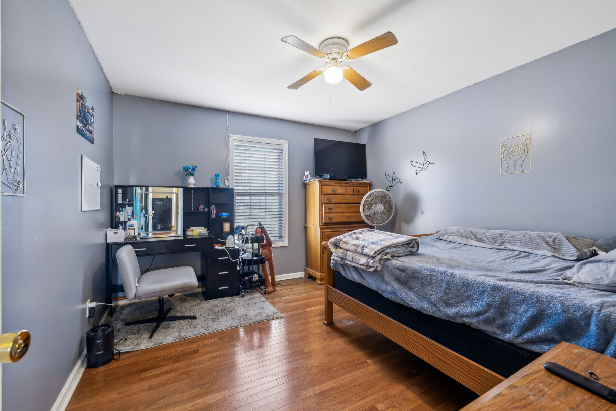 819 Blakemore Road Dickson, TN 37055 - Photo 28 of 54 a bedroom with furniture and a chandelier