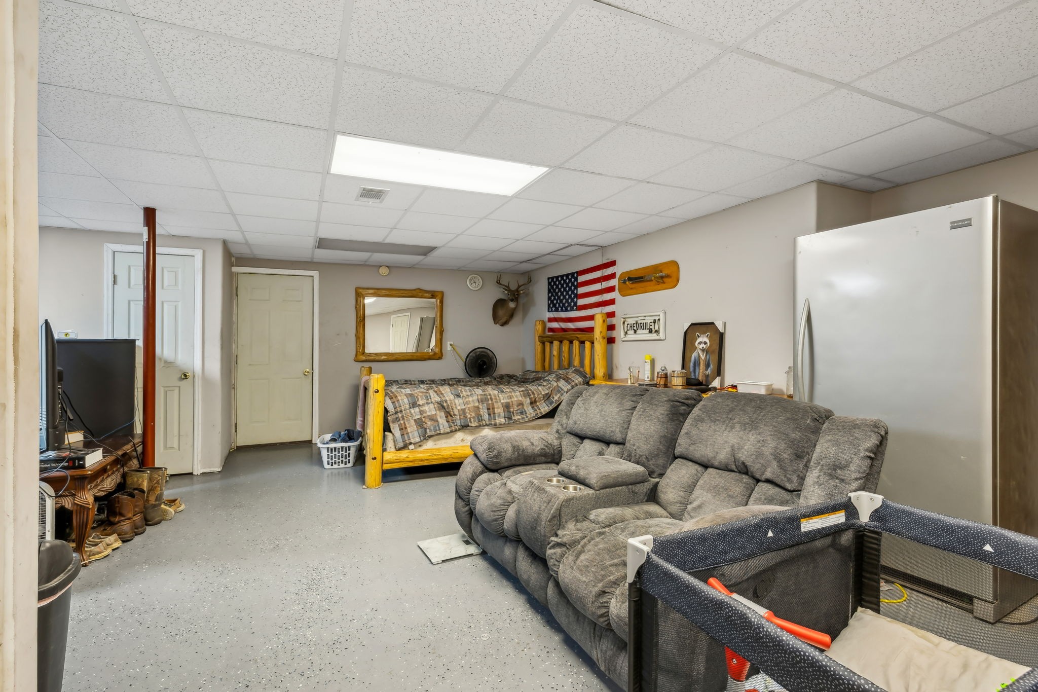 819 Blakemore Road Dickson, TN 37055 - Photo 37 of 54 a living room with furniture and a flat screen tv