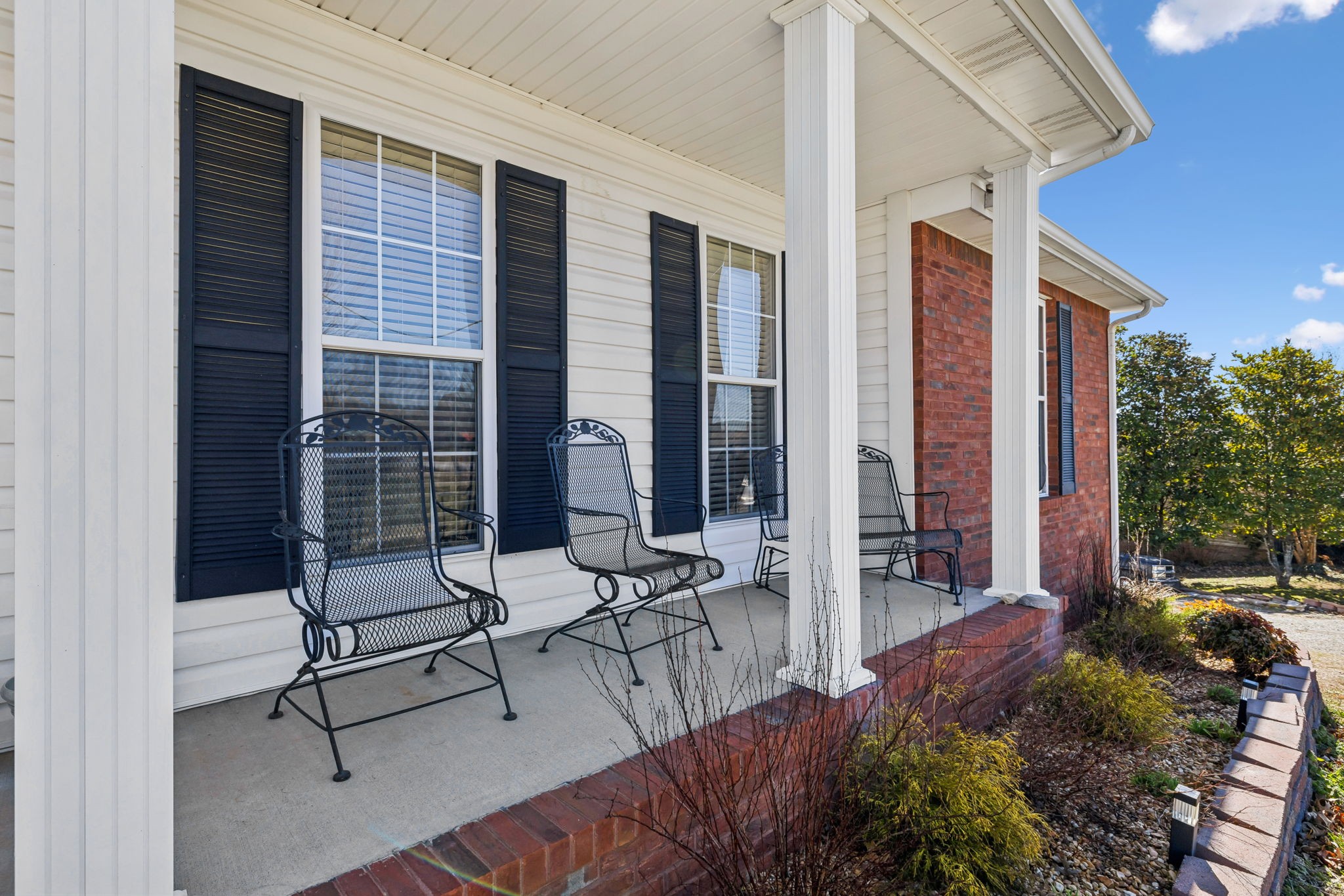 819 Blakemore Road Dickson, TN 37055 - Photo 6 of 54 a building outdoor space with patio furniture and potted plants