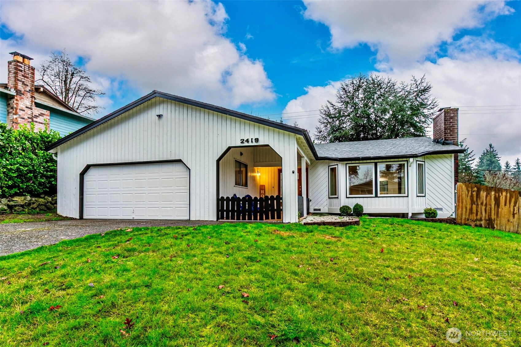 2419 Southwest 319th Place Federal Way, WA 98023 - Photo 40 of 40 a view of a house with a yard and sitting area