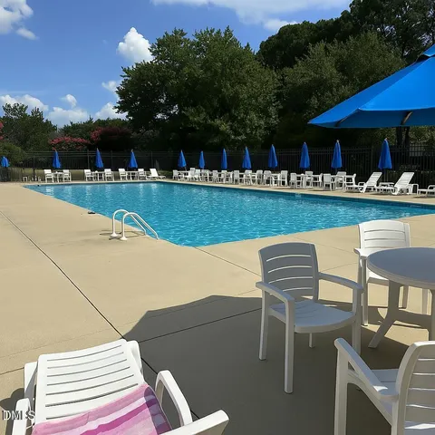 a view of swimming pool with seating space