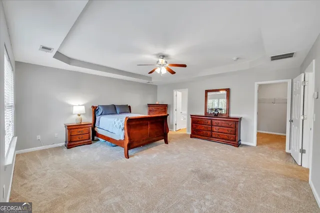a bed room with a bed and a chandelier