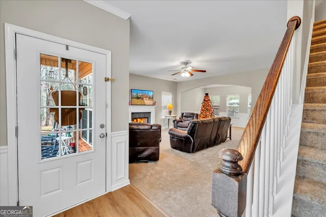 a view of a livingroom with furniture and a window