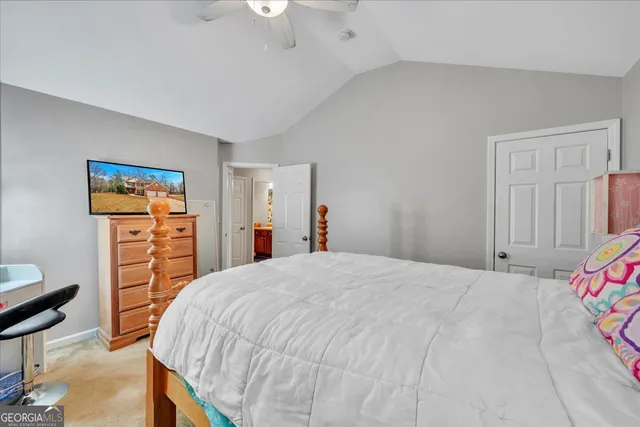 a bedroom with a bed and a closet