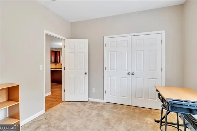 a view of room with furniture and wooden floor