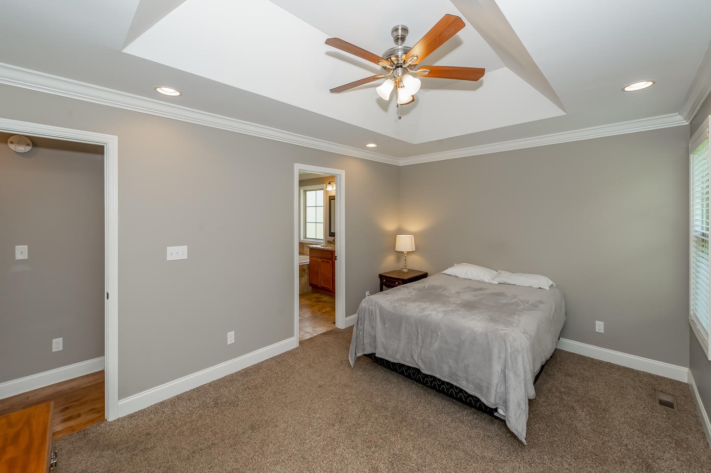 159 Crossroads Boulevard Oak Ridge, TN 37830 - Photo 15 of 28 a bedroom with a bed and a chandelier
