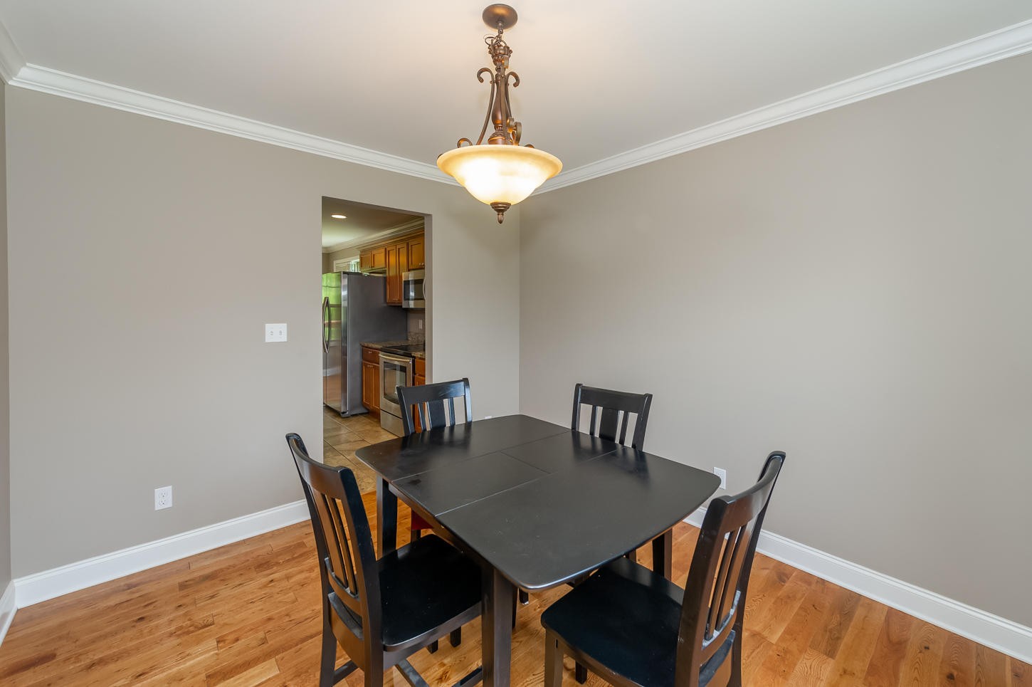 159 Crossroads Boulevard Oak Ridge, TN 37830 - Photo 5 of 28 a view of a dining room with furniture and wooden floor