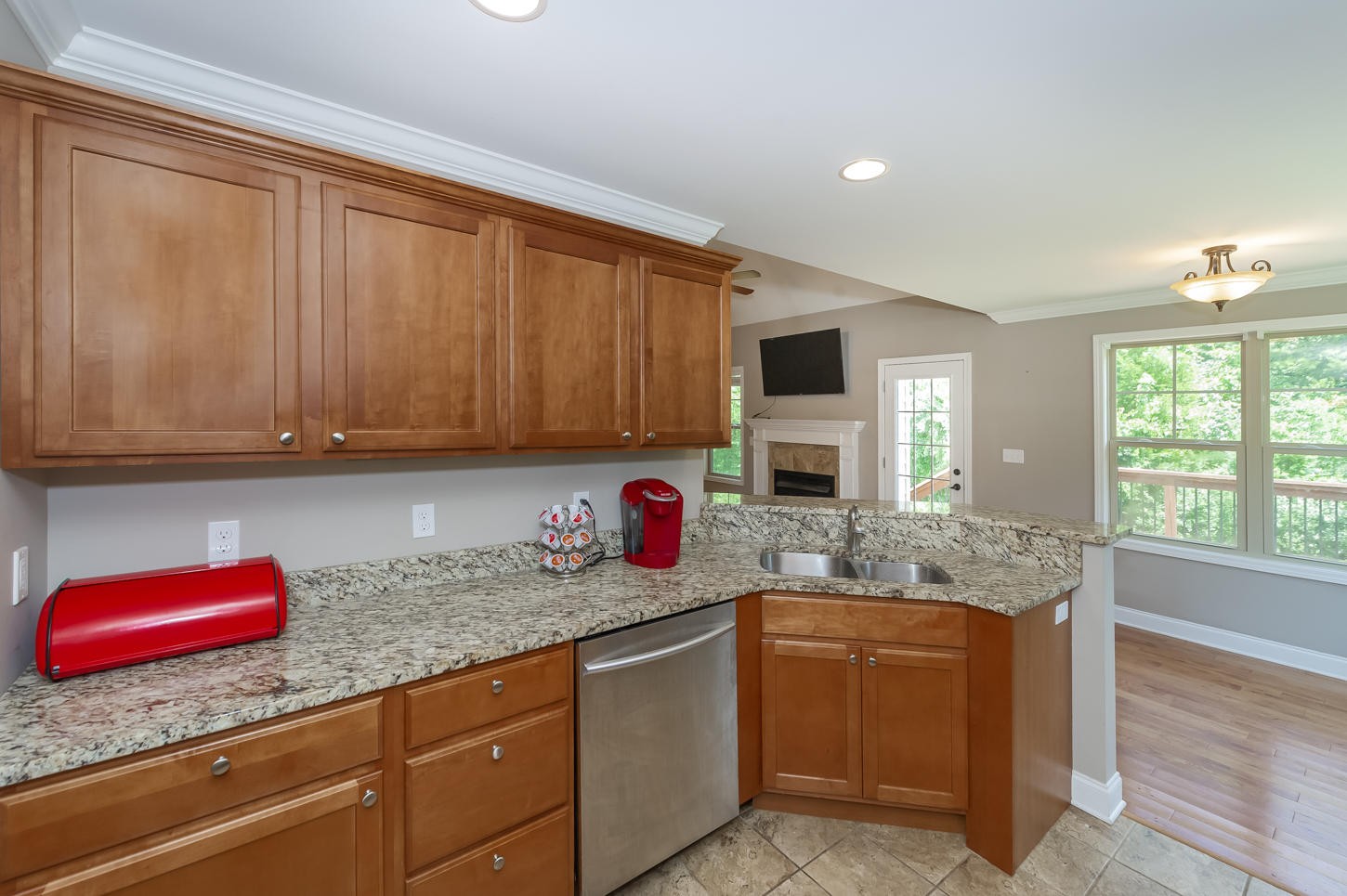 159 Crossroads Boulevard Oak Ridge, TN 37830 - Photo 6 of 28 a kitchen with granite countertop a sink dishwasher stove and cabinets