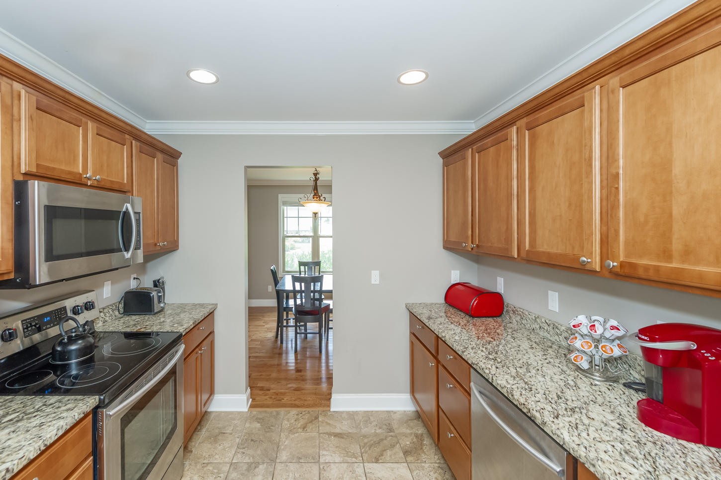 159 Crossroads Boulevard Oak Ridge, TN 37830 - Photo 7 of 28 a kitchen with granite countertop a sink stove and cabinets