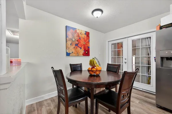 a kitchen with granite countertop a sink stainless steel appliances and counter space