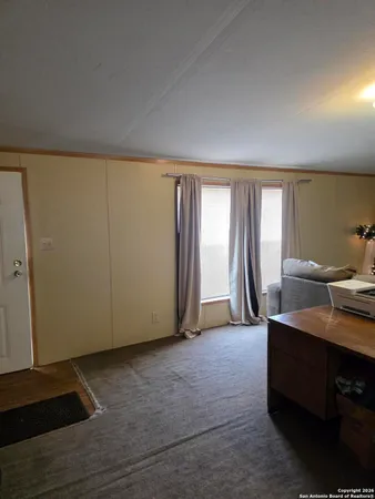 a room with furniture and a large window