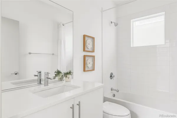 a bathroom with a sink toilet and vanity
