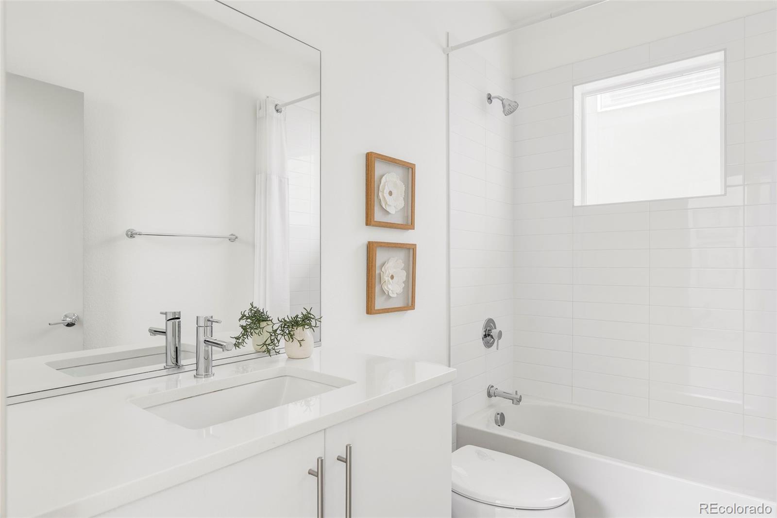 4015 Fenton Court Wheat Ridge, CO 80212 - Photo 19 of 31 a bathroom with a sink toilet and vanity
