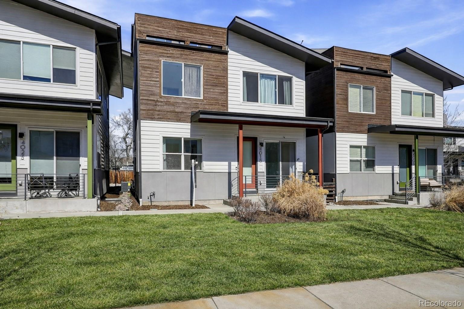 4015 Fenton Court Wheat Ridge, CO 80212 - Photo 24 of 31 a front view of a house with garden