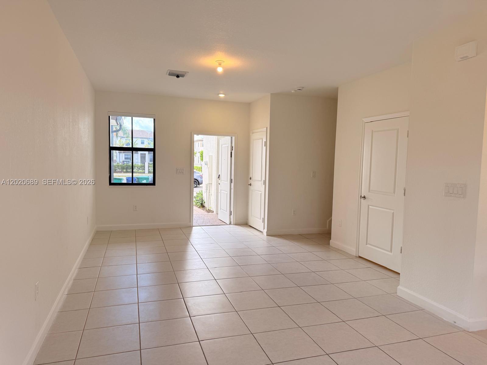 12875 Southwest 231st Terrace Miami, FL 33170 - Photo 6 of 25 a view of an empty room and window