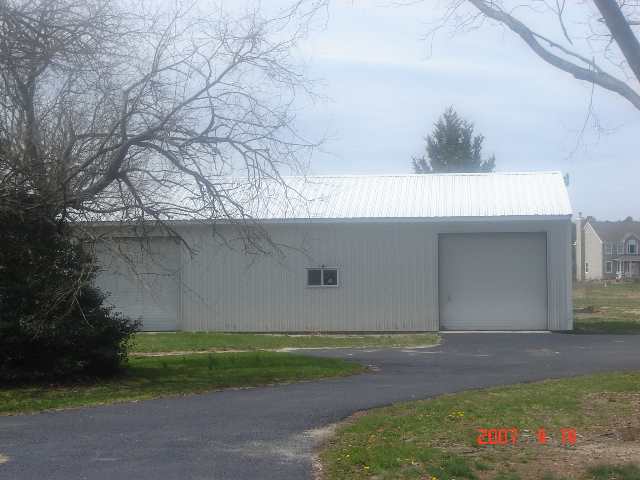 1447 Back Line Road Hammonton, NJ 08037 - Photo 3 of 3 a backyard of a house with plants and trees