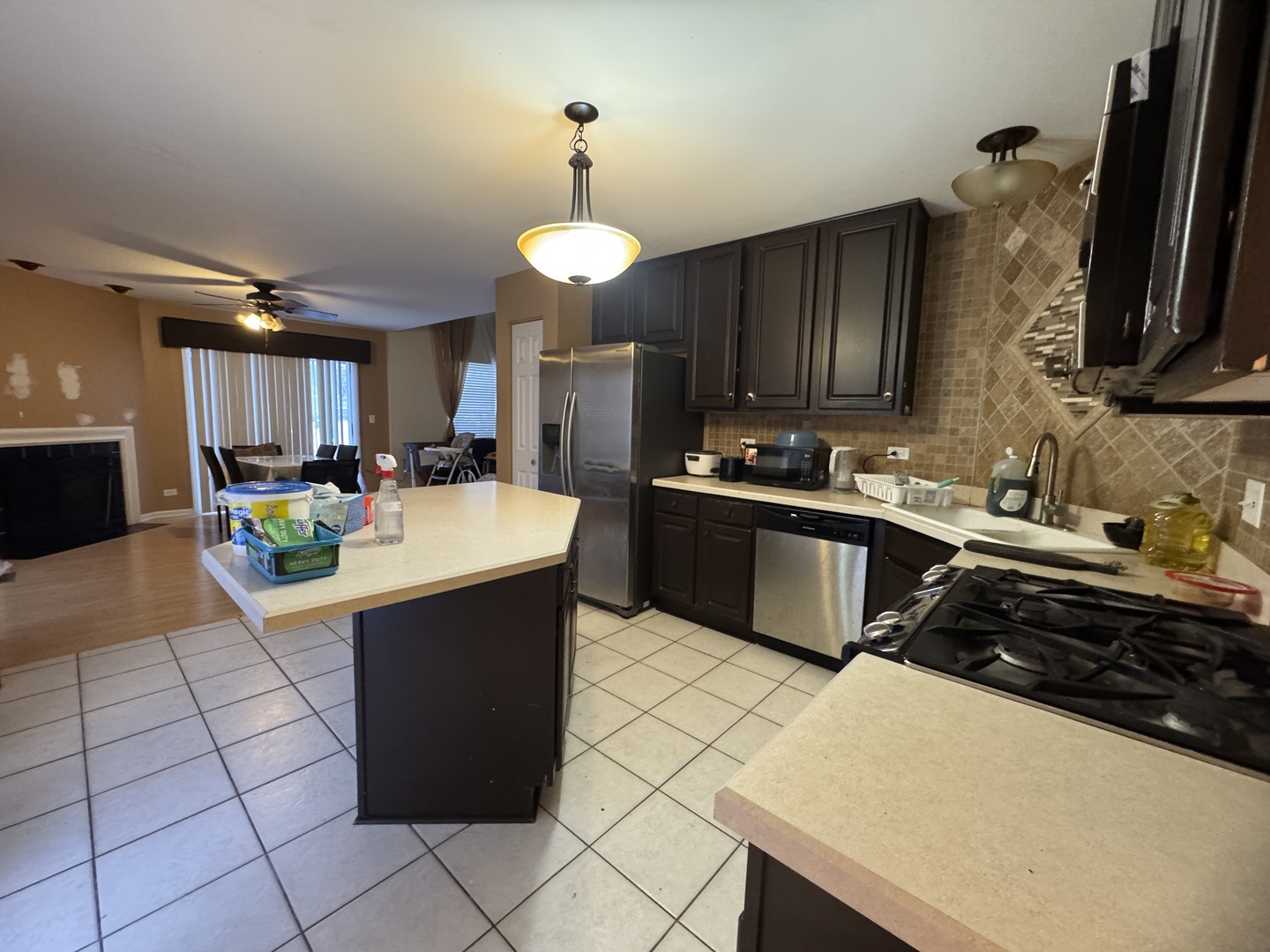 3281 Cool Springs Court Naperville, IL 60564 - Photo 5 of 16 a kitchen with a sink a stove and cabinets