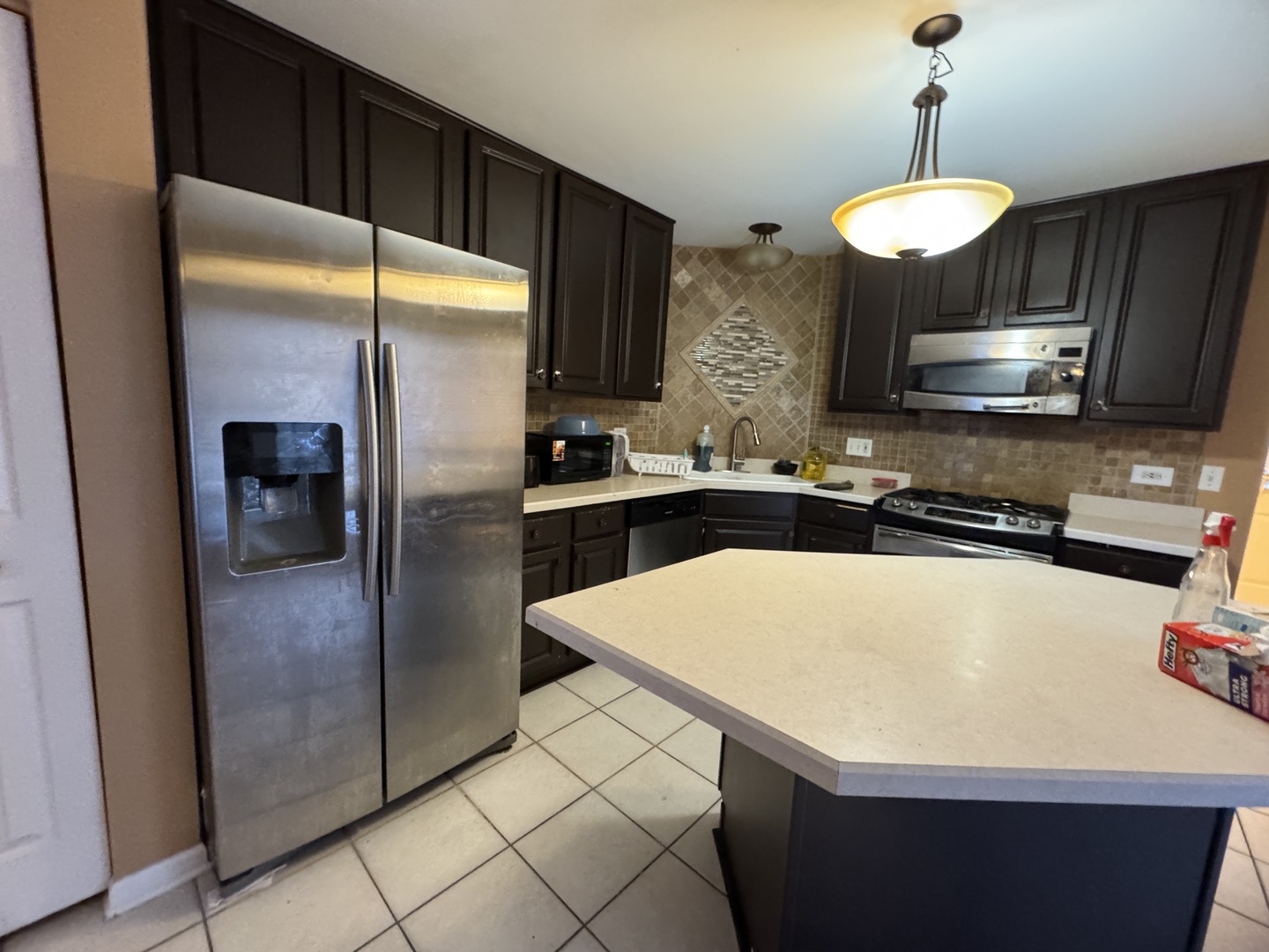 3281 Cool Springs Court Naperville, IL 60564 - Photo 7 of 16 a kitchen with stainless steel appliances a refrigerator a sink a stove and a refrigerator