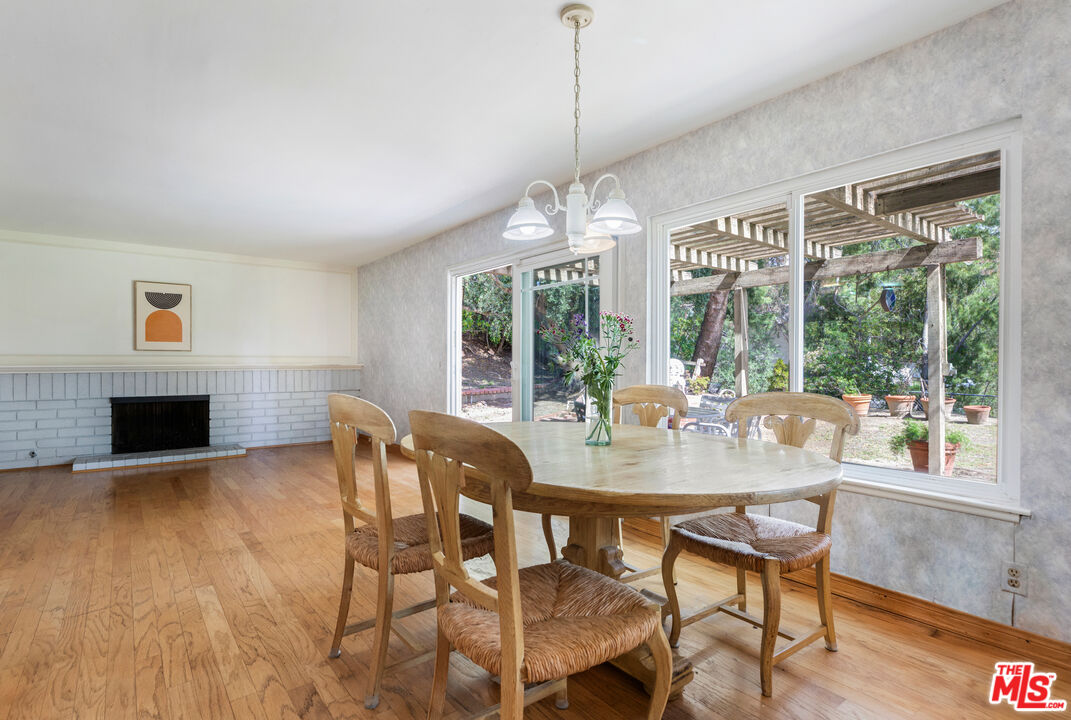 11774 Doral Avenue Porter Ranch, CA 91326 - Photo 14 of 30 a view of a dining room with furniture window and wooden floor