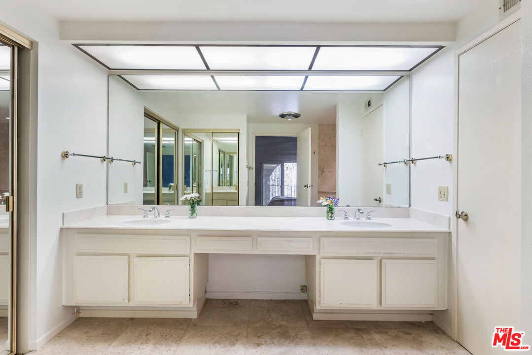 11774 Doral Avenue Porter Ranch, CA 91326 - Photo 22 of 30 a bathroom with a sink and a mirror
