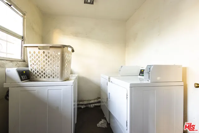 a view of a house with yard and sitting area