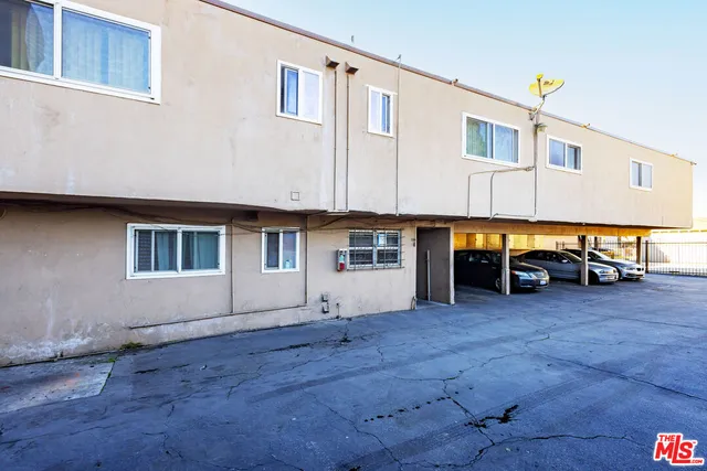 a view of car parked in front of house