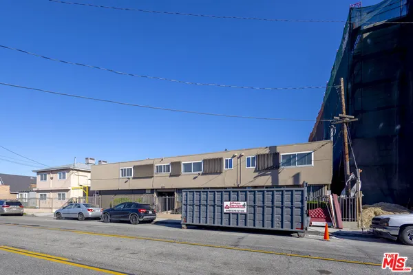 a view of a cars parked in front of a building